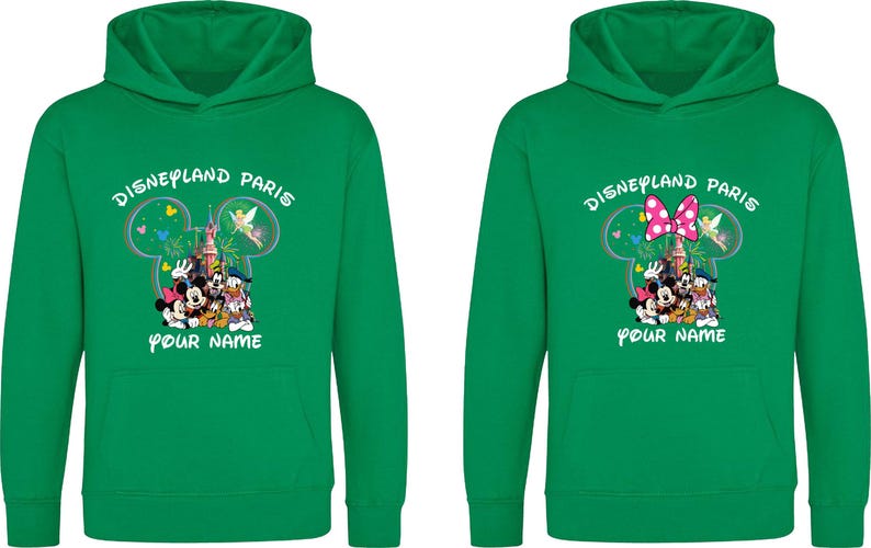 May include: Two green hooded sweatshirts with the text "Disneyland Paris" and a graphic of Mickey Mouse, Minnie Mouse, Donald Duck, and other characters. One has a pink bow. The text "YOUR NAME" is below the graphic.