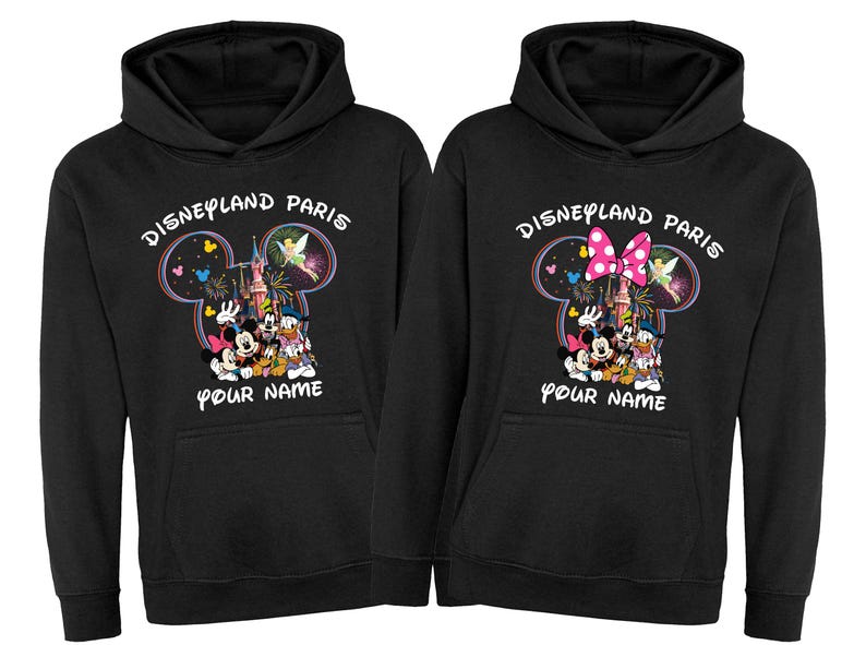 May include: Two black hoodies with a Disneyland Paris graphic. The graphic features Mickey and Minnie Mouse, Donald Duck, and Goofy, with the text "Disneyland Paris" and "Your Name". The design includes a castle and fireworks.