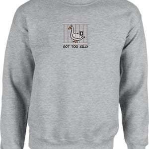 May include: A gray sweatshirt with a white duck in a cage graphic and the text "GOT TOO SILLY".