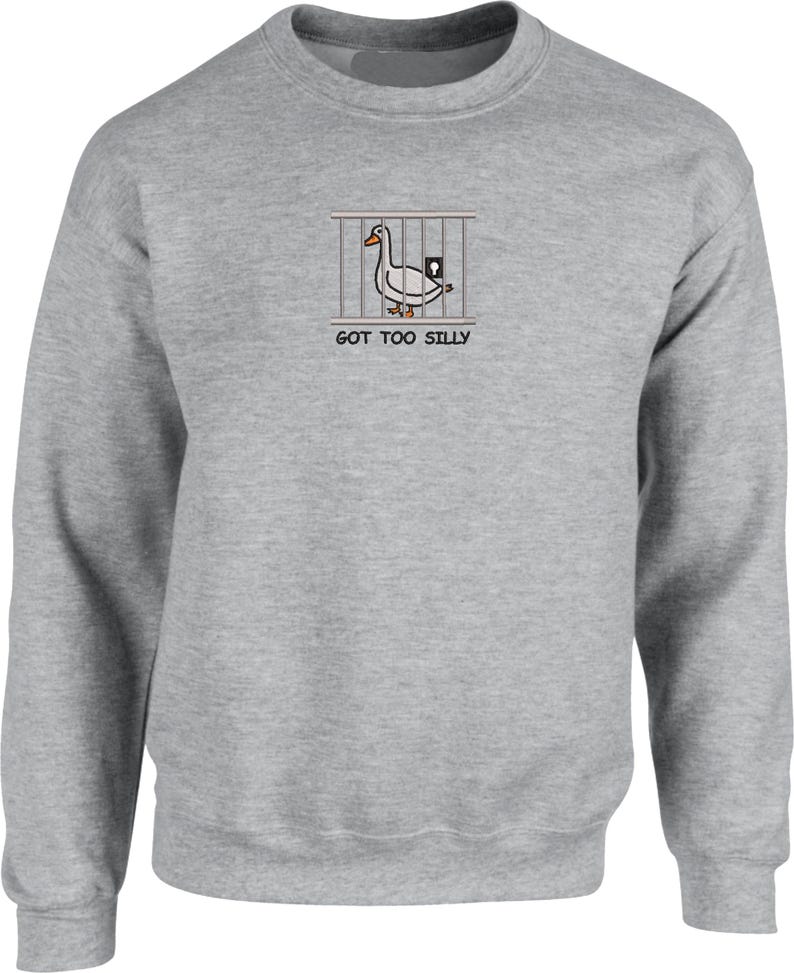 May include: A gray sweatshirt with a white duck in a cage graphic and the text "GOT TOO SILLY".