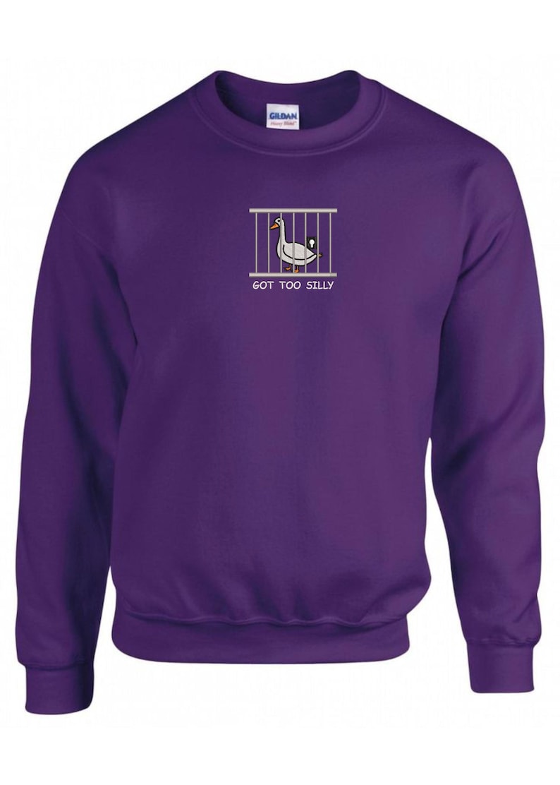 May include: Purple sweatshirt with a white goose in a cage graphic and the text "GOT TOO SILLY".