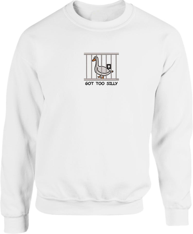 May include: White long-sleeve sweatshirt with a cartoon image of a duck in a cage and the text "GOT TOO SILLY".