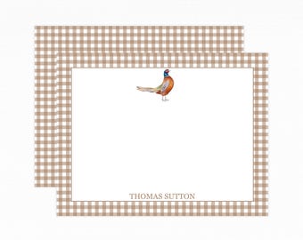 May include: Stationery set featuring a watercolor pheasant illustration. The white notecards have a brown gingham border and the name "THOMAS SUTTON" printed at the bottom. The set includes two notecards.