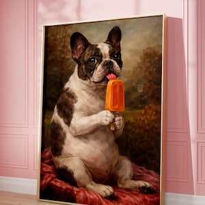May include: A framed painting of a French Bulldog holding an orange popsicle. The dog has a white and brown coat and is sitting on a red cushion. The background shows a landscape with trees and a small building. The painting has a gold frame.
