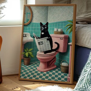 May include: A black cat with a white bib sits on a pink toilet in a bathroom with green tile. The cat is reading a newspaper with the headline "Cat Claims Throne".