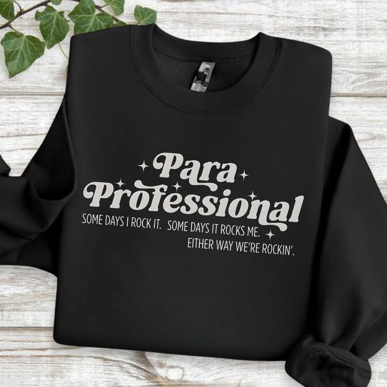 A black sweatshirt with white text printed on it.