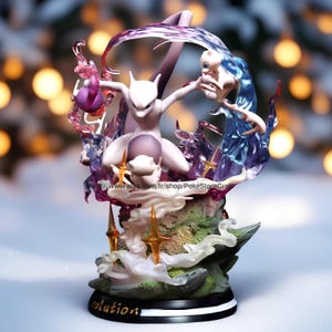 May include: A detailed, hand-painted figurine of a pink and white Pokemon, Mewtwo, with a blue and white Pokemon, Mew, in the background. The figurine is set on a base with a green and brown rocky surface and the word "evolution" written on the front.