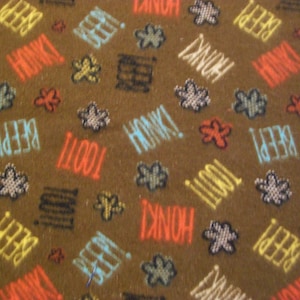 Beep Honk Toot Words & Flowers Snuggle Flannel Fabric - BTY - Brown Orange Blue Black Yellow