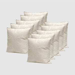May include: A set of ten off-white square cushion pads. The cushions are arranged in a staggered pattern, with the largest cushion at the back and the smallest cushion at the front.