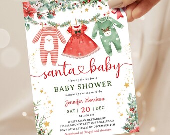 May include: A baby shower invitation with a festive Christmas theme. The design features baby clothes hanging on a clothesline, with the words "santa baby" in cursive. The invitation includes details for the baby shower.