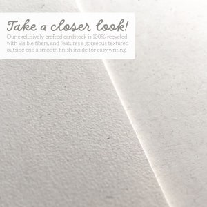 May include: Close-up of a white textured cardstock with the text "Take a closer look! Our exclusively crafted cardstock is 100% recycled with visible fibers, and features a gorgeous textured outside and a smooth finish inside for easy writing."
