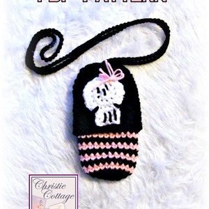 May include: A black and pink crocheted skull-shaped phone case with a black strap. The case has a white skull design and a pink bow. The text "PDF PATTERN" is at the top of the image. The text "Christie Cottage" is at the bottom of the image.