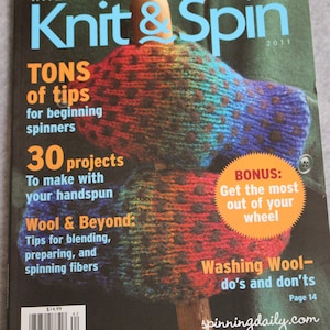 May include: Knit & Spin magazine cover featuring a colorful knitted mitten with a polka dot pattern. The magazine title is in blue and white text. The cover also includes the text "TONS of tips for beginning spinners", "30 projects To make with your handspun", "Wool & Beyond: Tips for blending, preparing, and spinning fibers", "BONUS: Get the most out of your wheel", "Washing Wool - do's and don'ts", and "spinningdaily.com".