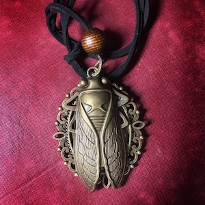 Cicada Pendant on vegan cord.