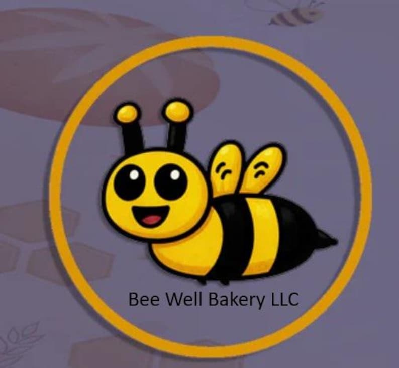 May include: A circular logo featuring a cartoon bee with a yellow and black striped body, large black eyes, and a smiling mouth. The bee is enclosed within a thick yellow ring. Below the bee, the text Bee Well Bakery LLC is printed in black.