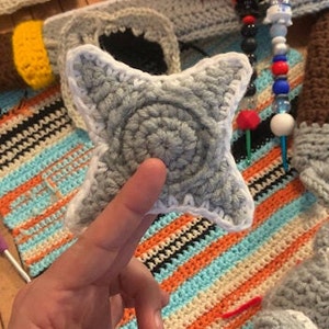 This is the Ninja Star with a weighted 4 White Yarn for the stitches on the outside bevel.