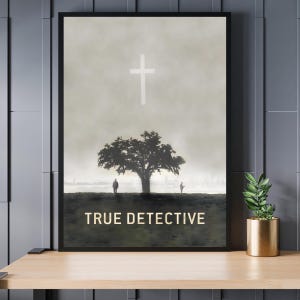 May include: A minimalist poster with a black frame featuring a silhouette of a tree and two figures standing in front of it. The background is a hazy gray with a white cross at the top. The text "TRUE DETECTIVE" is printed in gold at the bottom of the poster.