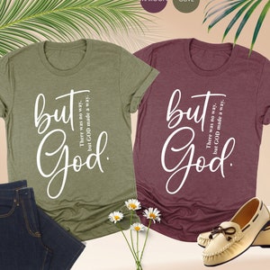 two shirts that say but god and a pair of jeans