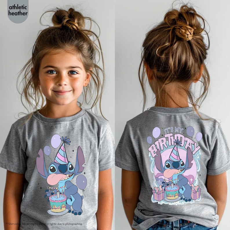May include: Grey t-shirt with a cartoon character design, a party hat, cake, and balloons. The front and back of the shirt show the character with the text "IT'S MY BIRTHDAY".