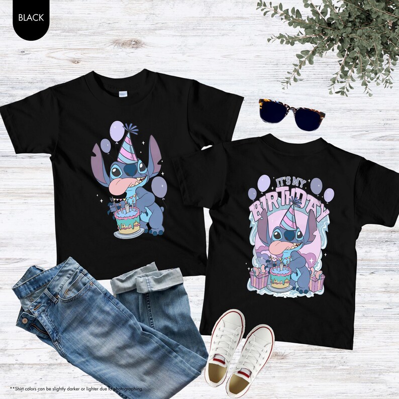 May include: Two black t-shirts with a cartoon character graphic. One shirt features the character with a birthday cake and balloons. The other shirt has the text "IT'S MY BIRTHDAY". The image also includes blue jeans, white trainers, and sunglasses.