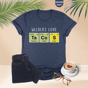 a t - shirt that says welders love taco's next to