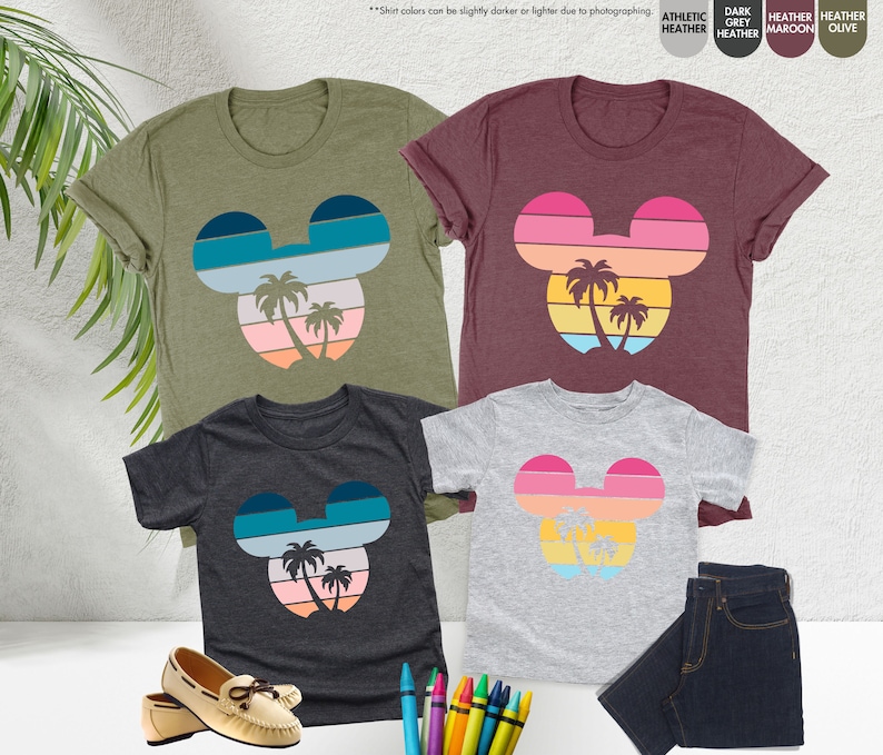 three t - shirts with mickey mouse faces on them