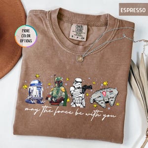Puede incluir: Un juego de tres tazas de cer&aacute;mica con acabado mate moteado. Las tazas son de color crema, gris claro y gris oscuro. Cada taza tiene un dise&ntilde;o simple y minimalista.