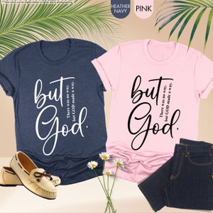 two t - shirts and a pair of shoes on a table