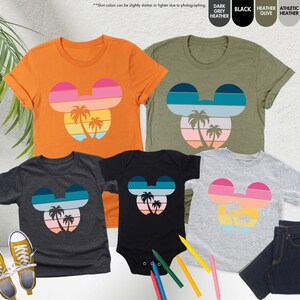 a group of t - shirts with mickey ears on them