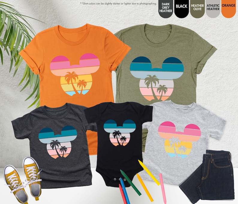 a group of t - shirts with mickey ears on them