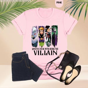 a pink shirt with a picture of villain characters on it