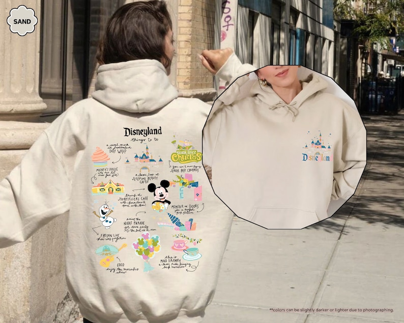 a person wearing a mickey mouse hoodie on a city street