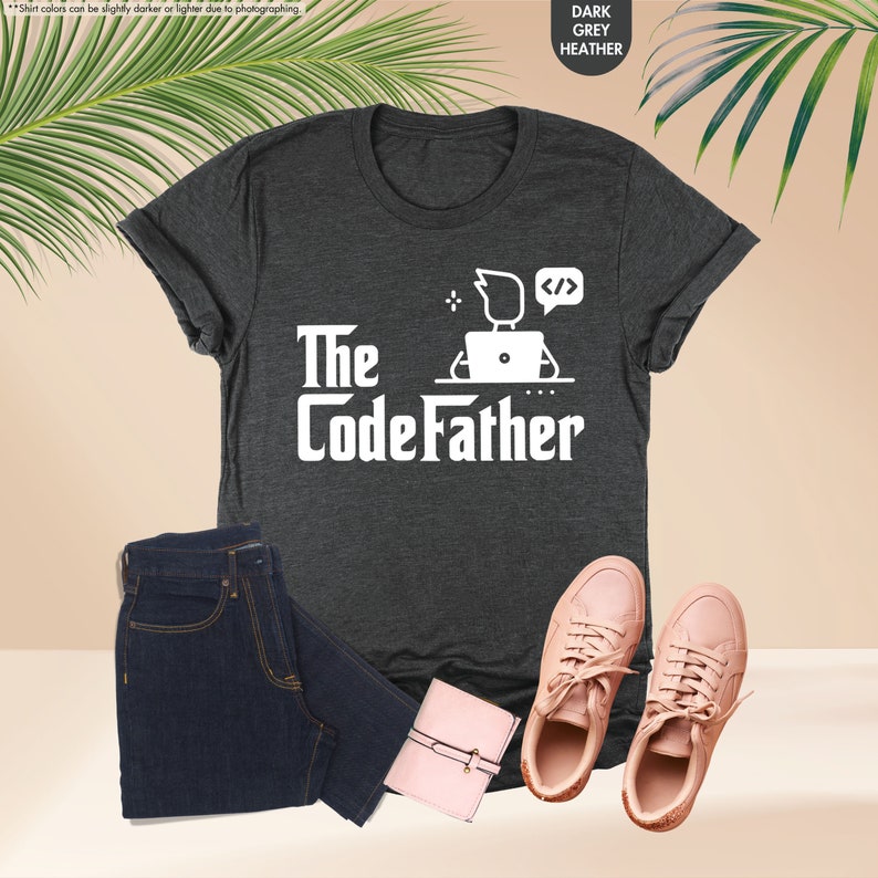 a t - shirt that says the codefather next to a pair of jeans