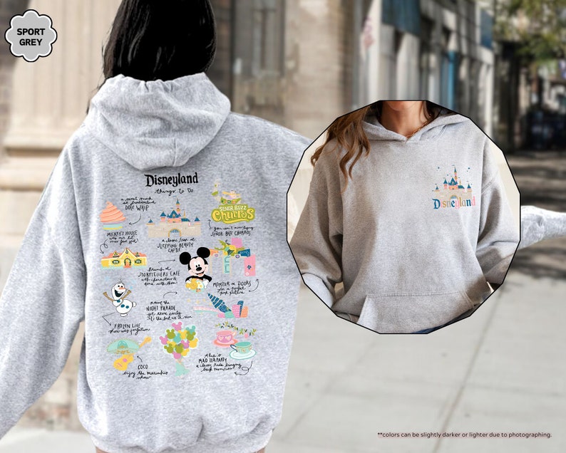 a woman wearing a mickey mouse hoodie on the street