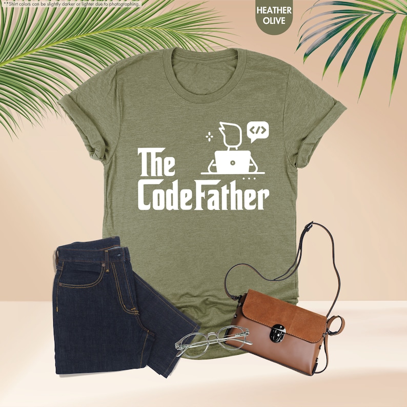a t - shirt that says the codefather next to a pair of jeans