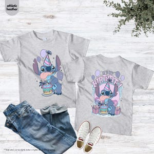 May include: Grey t-shirts with a cartoon character design, party hat, cake, and balloons. The front of the shirt shows the character, and the back says "It's My Birthday". The image also includes blue jeans and white trainers.