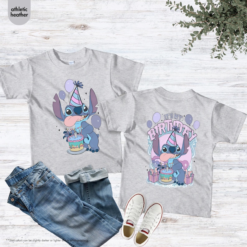 May include: Grey t-shirts with a cartoon character design, party hat, cake, and balloons. The front of the shirt shows the character, and the back says "It's My Birthday". The image also includes blue jeans and white trainers.