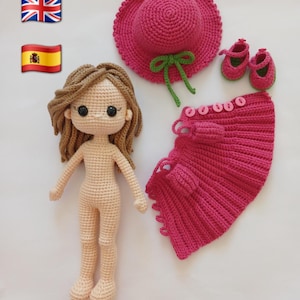 May include: A crochet doll with light brown hair, a pink hat, skirt, and shoes. The doll is nude, and the accessories are a vibrant pink with green accents. The set is handmade, suitable for a child's toy or decorative item.