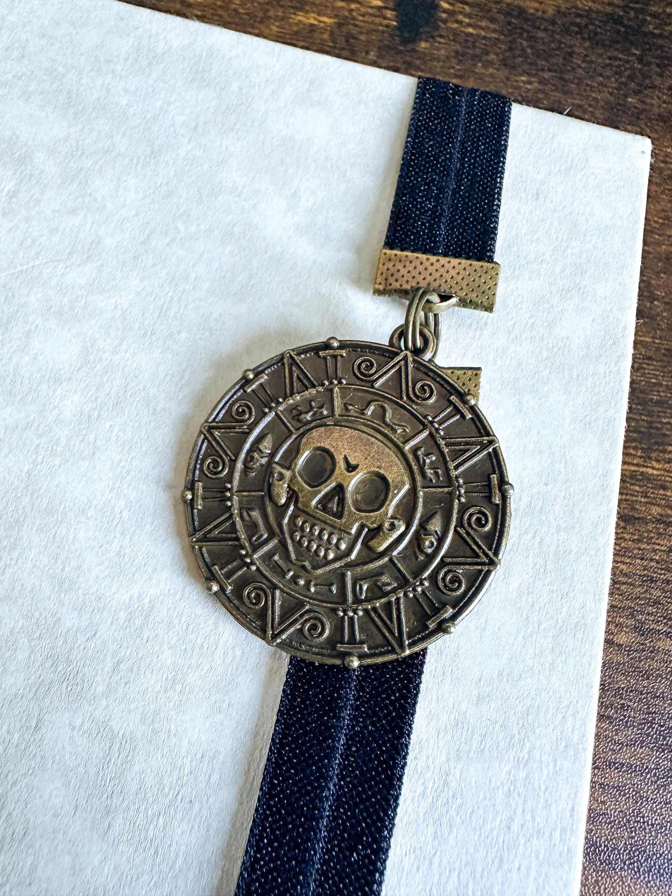 Pirates of the Caribbean Cursed Aztec Coin Medallion Elastic Bookmark ...