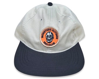 Monsters Outside Fan Club Strapback Hat with Soft Visor