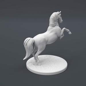 May include: A white ceramic figurine of a horse rearing up on its hind legs. The horse has a long flowing mane and tail. The figurine is standing on a round base.