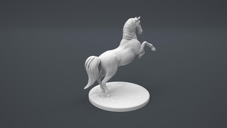 May include: A white ceramic figurine of a horse rearing up on its hind legs. The horse has a long flowing mane and tail. The figurine is standing on a round base.