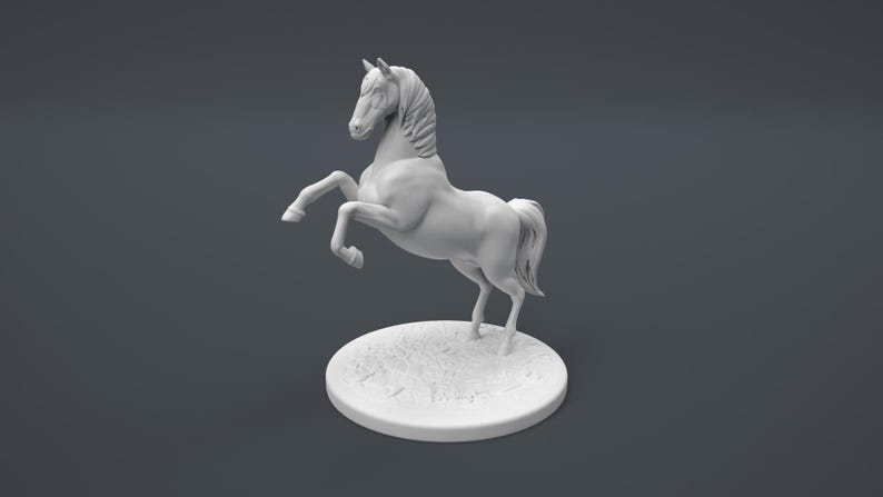 May include: White ceramic figurine of a horse rearing up on its hind legs. The horse has a flowing mane and tail. The figurine is standing on a small, round base.