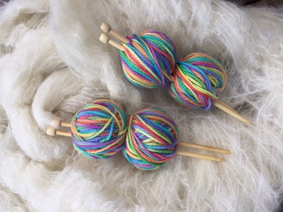 Two Balls of Yarn, a Spindle and Knitting Needles Stock Image