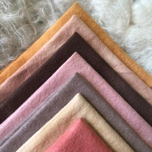 May include: A set of ten fabric swatches in various shades of brown, pink, and beige. The swatches are arranged in a triangular pattern, with the darkest shade at the top and the lightest shade at the bottom.