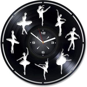 May include: A black vinyl record clock with a white clock face and silver hands. The clock face has the numbers 12, 3, 6, and 9. The record is decorated with silhouettes of ballerinas in various poses.