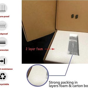 May include: A cardboard box with a white foam interior. The box is labeled "2 layer foam" and "Strong packing in layers foam & carton box."