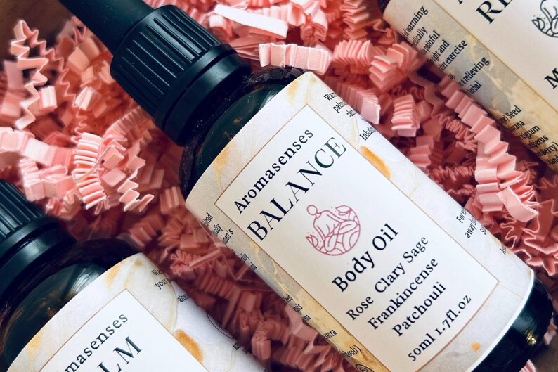 Massage oil bottle in pink packaging