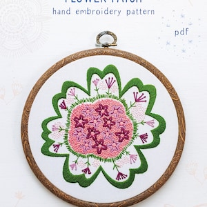 May include: A hand embroidery pattern for a flower patch, featuring a pink and green flower design in a wooden embroidery hoop. The pattern is available as a PDF download. The text "FLOWER PATCH" and "hand embroidery pattern" are at the top of the image. The text "pdf" is in the upper right corner of the image. The text "COZYBLUE handmade" is at the bottom of the image.