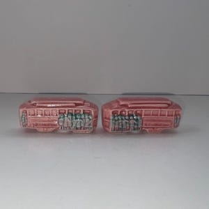 Vintage pink RAILCAR Salt and pepper shakers with people in blue color, unknown manufacturer, unknown date (see pics).